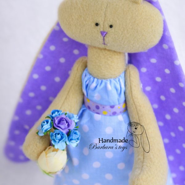 handmade rabbit toy in pastel dress